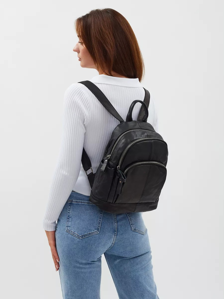 Black leather backpack for women, compact size, zippered pockets, adjustable straps, urban design, Mana model