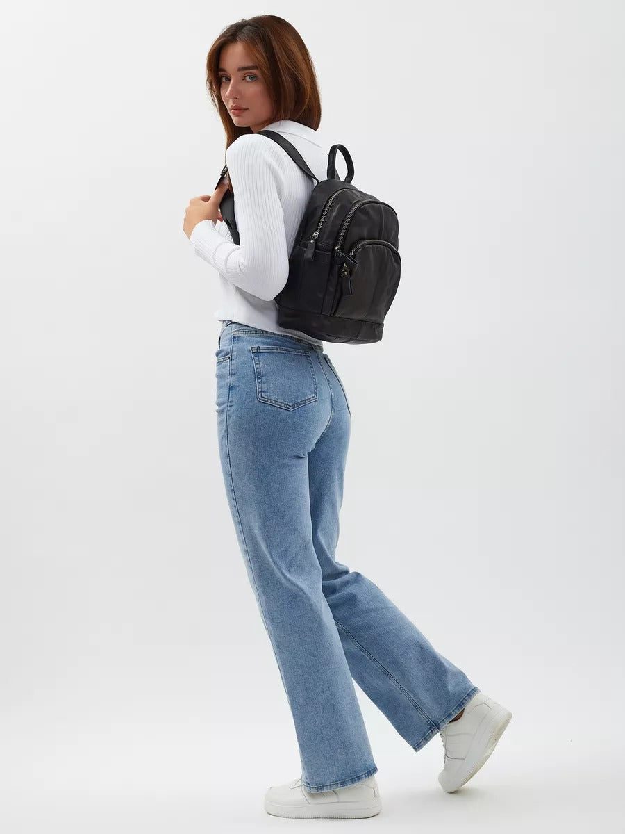 Black leather backpack for women, compact size, zippered pockets, adjustable straps, urban design, Mana model