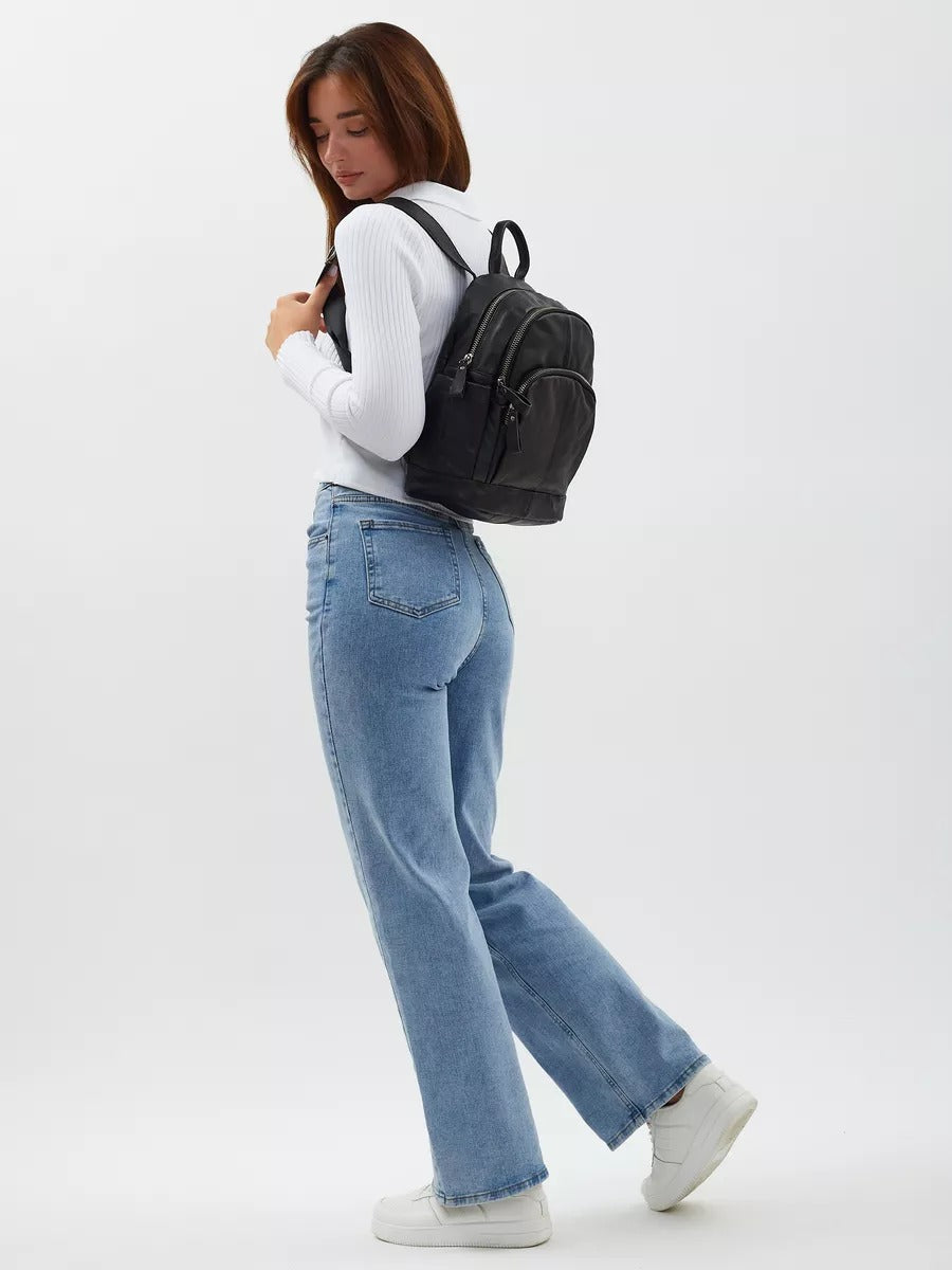 Black leather backpack for women, compact size, zippered pockets, adjustable straps, urban design, Mana model