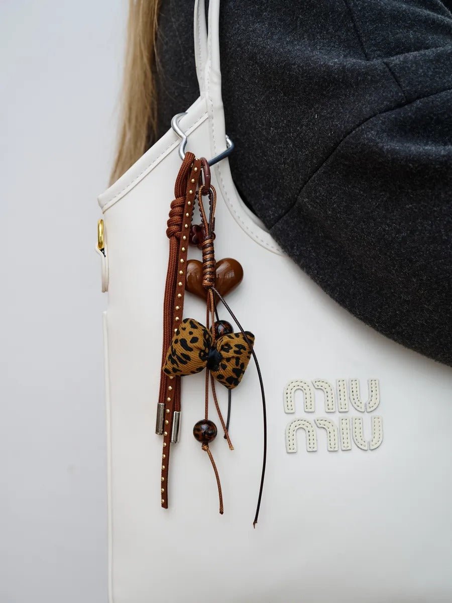 Bijou de sac cœur, nœud léopard, breloques marron, attache mousqueton, accessoire mode, modèle Loca - Marron