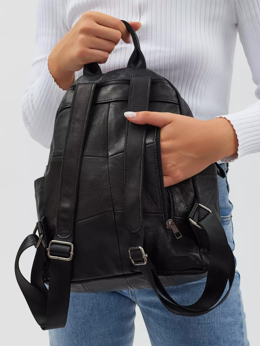 Black leather backpack for women, compact size, zippered pockets, adjustable straps, urban design, Mana model