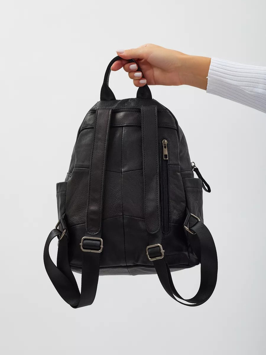 Black leather backpack for women, compact size, zippered pockets, adjustable straps, urban design, Mana model